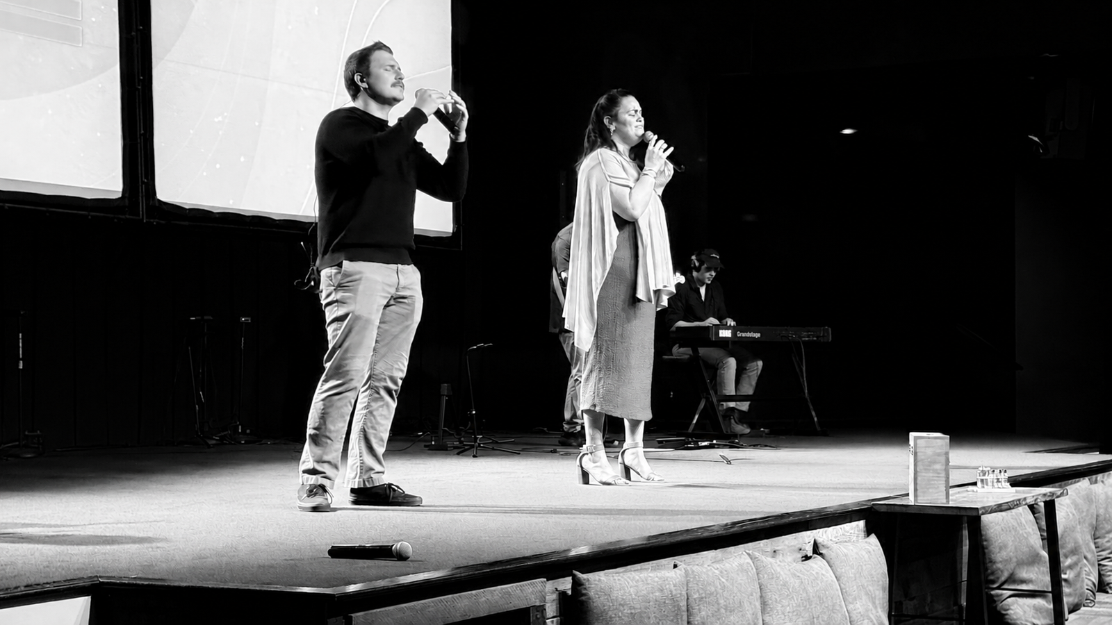 Worship team singing on stage