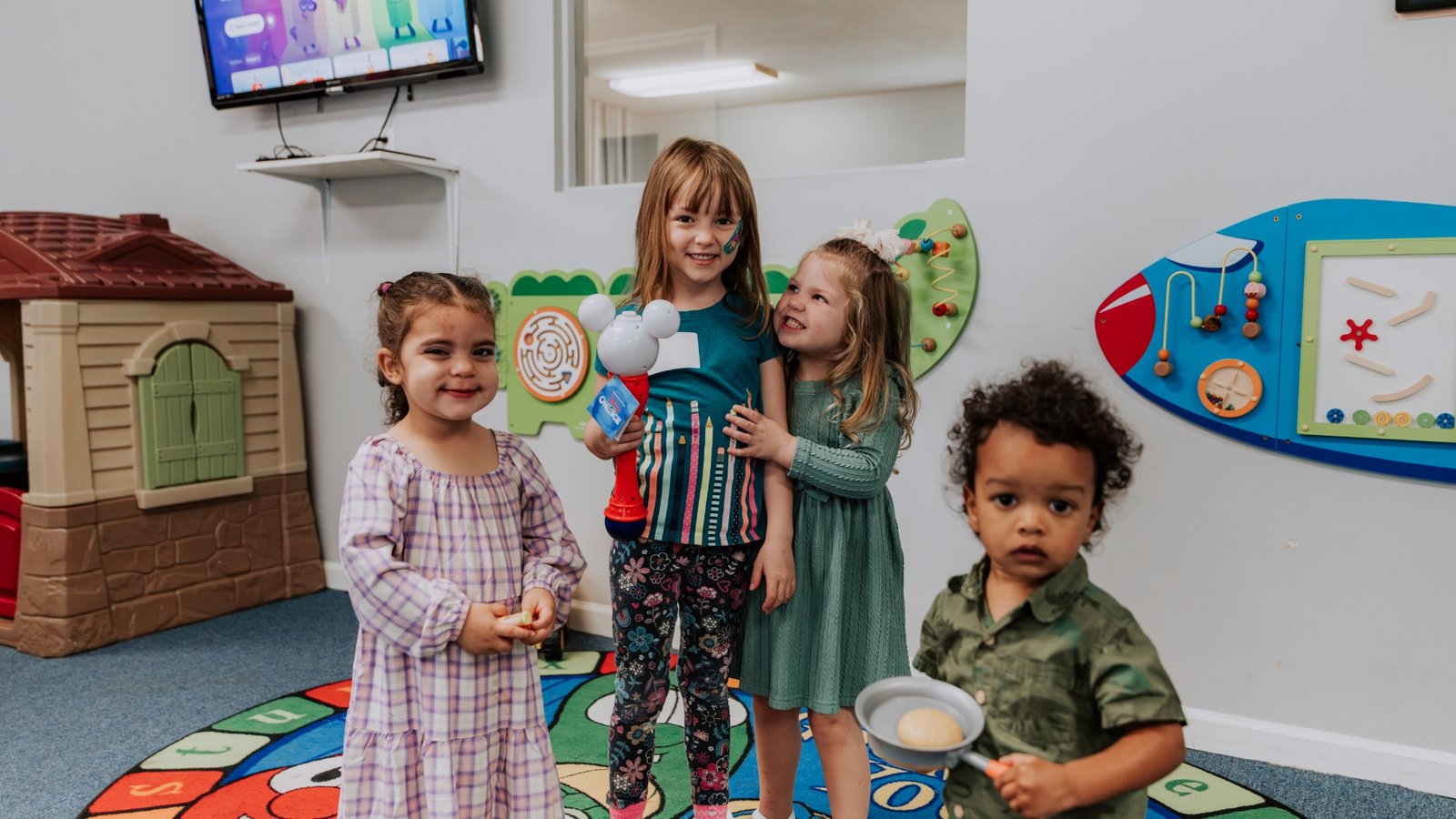 Kids smiling together in the classroom