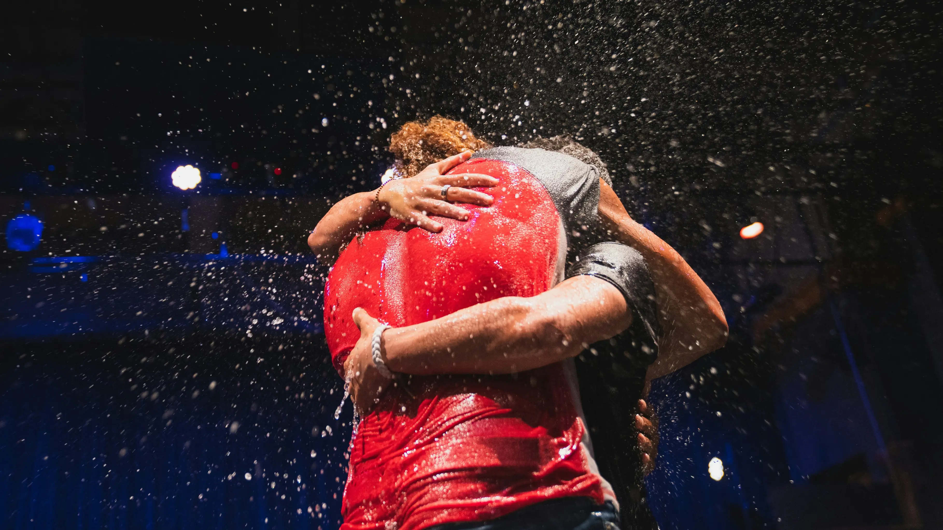 Two people hugging after a baptism